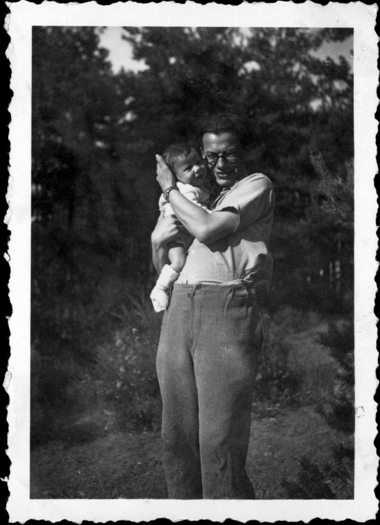 Pierre Sauvage as a baby in the arms of father Léo Sauvage in Le Chambon in 1944 (with old photo borders). Courtesy of Chambon Foundation for _America