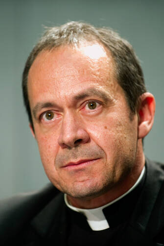 Msgr. Antoine Camilleri, undersecretary for relations with states and head of the Vatican delegation to the Moneyval plenary, is pictured during a 2013 news conference in Rome. (CNS photo/Giancarlo Giuliani, Catholic Press Photo) 
