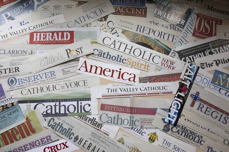 The numbers show that Catholic print publications are still an effective means of communication. (CNS photo/Tyler Orsburn) 