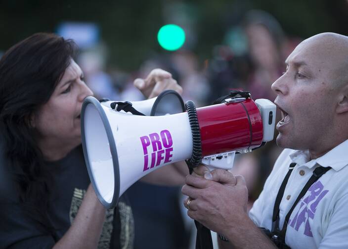 Demonstrators gather outside the U.S. Supreme Court in Washington on July 9, 2018. (CNS photo/Tyler Orsburn)