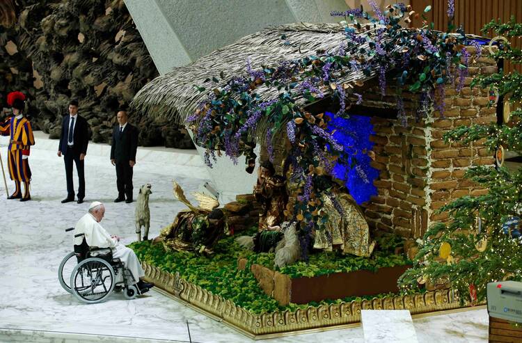 Pope Francis visits a Nativity scene during an audience with the donors of the Vatican Christmas tree and the Nativity scenes, in the Paul VI hall at the Vatican.