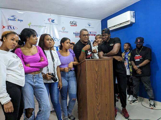 Liony Batista, holding microphone, is the founder of Fundación Nueva Alegría in the Dominican Republic. Photo courtesy of Cross Catholic Outreach.