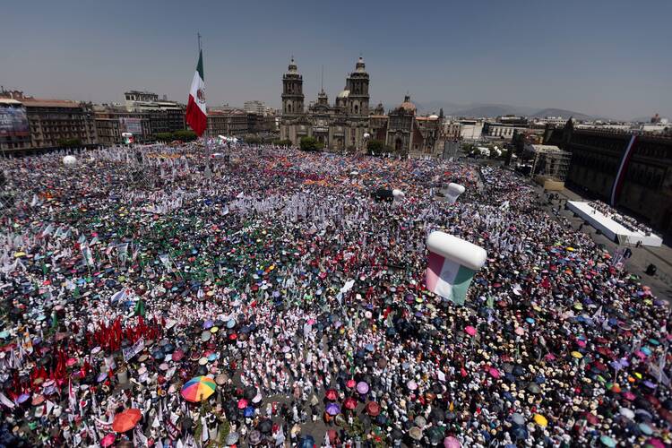 A large crowd gathers as Mexican President Claudia Sheinbaum speaks during a rally at Zocalo Square in Mexico City March 9, 2025. (OSV News photo/Quetzalli Nicte-Ha, Reuters)