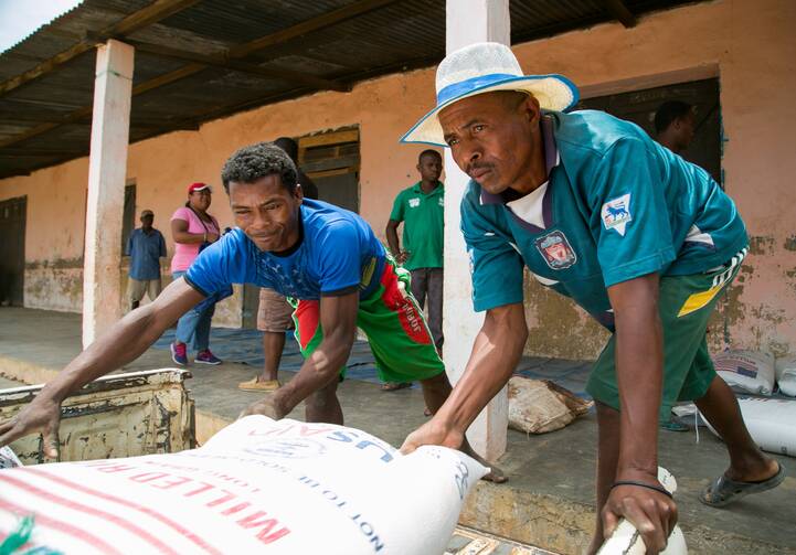 Workers unload food commodities from Catholic Relief Services and USAID in the village of Behera, near Tulear, Madagascar, Oct. 22, 2016. (OSV News Photo/Nancy McNally, Catholic Relief Services)