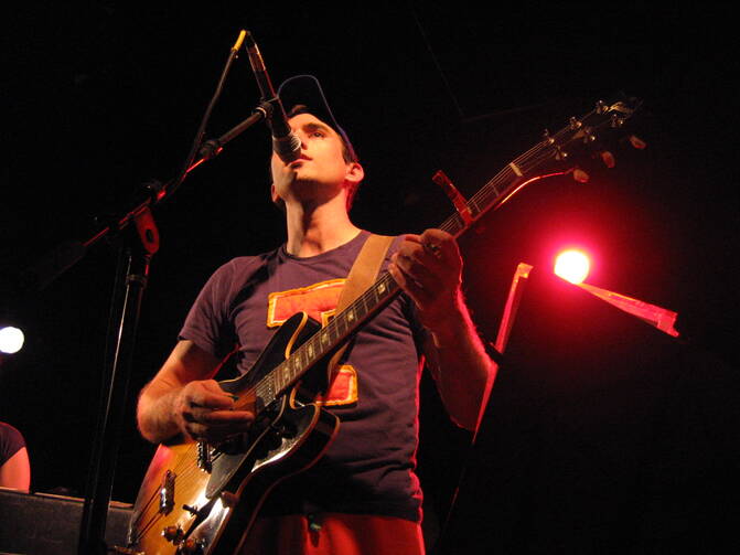 Sufjan Stevens performing on stage during a tour for the “Illinois” album (Wikimedia Commons).