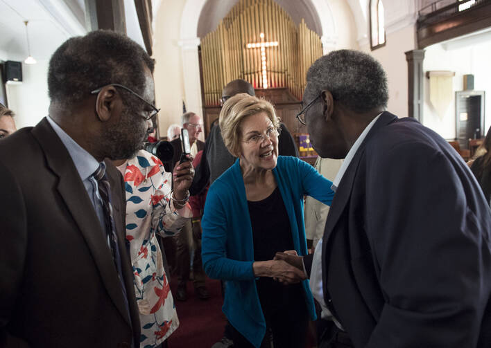 Democratic presidential candidate Sen. Elizabeth Warren, D-Mass., shakes hands with Alabama State Sen. Henry Sanders at the Brown Chapel AME Church in Selma, Ala., on March 19. (Jake Crandall/The Montgomery Advertiser via AP)