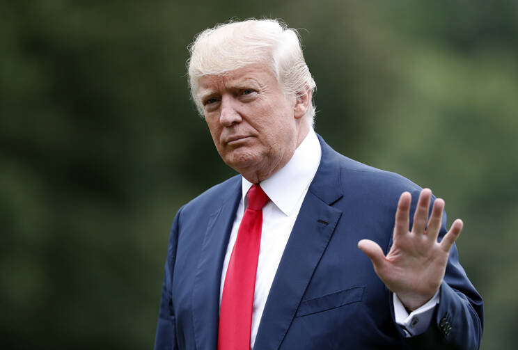 President Donald Trump waves as he arrives on the South Lawn of the White House in Washington, Monday, Aug. 14, 2017. Trump is returning from a vacation to Bedminster, N.J. (AP Photo/Alex Brandon)