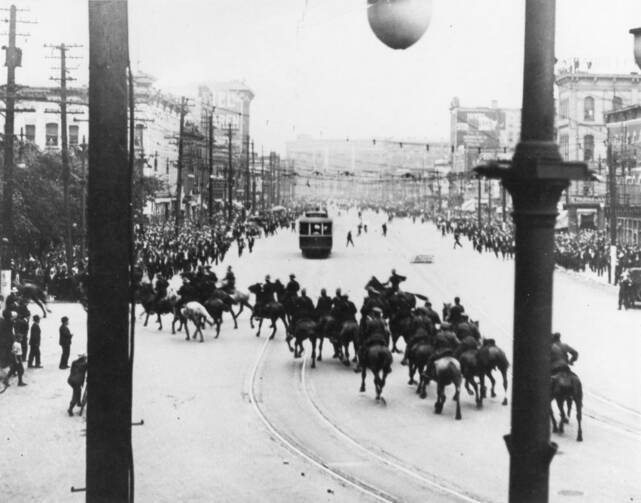 Royal North West Mounted Police operations in Winnipeg General Strike, 1919; turning left on William Street towards City Hall, shortly before firing into the crowd.