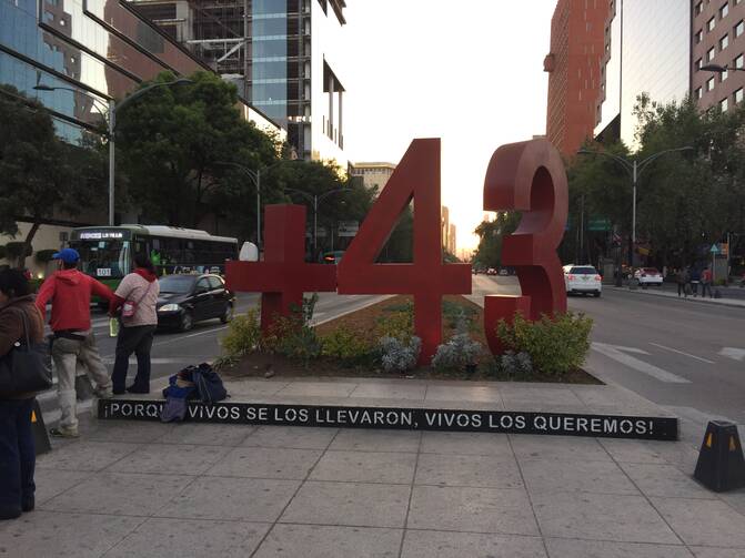 Street Sign. Remembering the Missing 43 (Photo by Kevin Clarke)