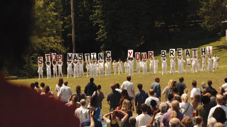 THE GUILTY REMNANT. ￼A mysterious cult protests a parade honoring the departed in the first episode of “The Leftovers.”