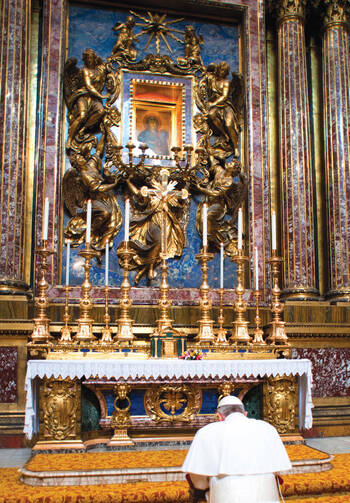 ￼THE POPE AT PRAYER. Pope Francis prays before an icon of Mary, Salvation of the Roman People, in a chapel of the Basilica of St. Mary Major in Rome the morning after his election.