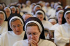 Dominican Sisters of St. Cecilia pray during Mass at the Cathedral of the Incarnation in Nashville, Tenn., on July 24, 2016. Members of religious orders who come from abroad and take a vow of poverty may find it more difficult to remain in the United States. (CNS photo/Rick Musacchio, Tennessee Register)