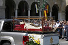 The coffin containing the body of St. John XXIII is seen during a ceremony in Vittorio Veneto Square after its arrival in Bergamo, Italy, May 24. The body of the late pope left the Vatican on May 24 to be displayed in his home region until June 10. (CNS photo/Paul Haring)