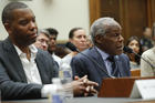 Actor Danny Glover, right, and author Ta-Nehisi Coates, left, testify about reparation for the descendants of slaves during a hearing before the House Judiciary Subcommittee on the Constitution, Civil Rights and Civil Liberties, at the Capitol in Washington, Wednesday, June 19, 2019. (AP Photo/Pablo Martinez Monsivais)