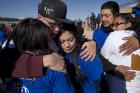 Family members embrace in El Paso, Texas, during a massive reunion called "Abrazos, No Muros" (Hugs, Not Walls) on Jan. 28. (CNS photo/David Maung)
