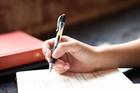 Writing poetry in a notebook